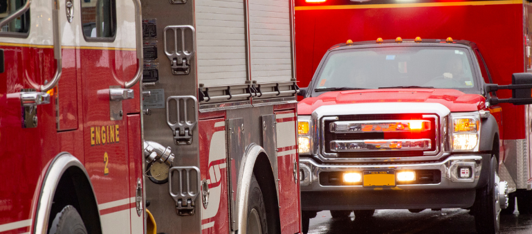 a picture of two ambulances in line (first responder and therapy)